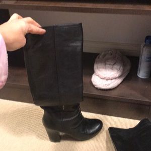 Black leather Prada tall and heeled boots